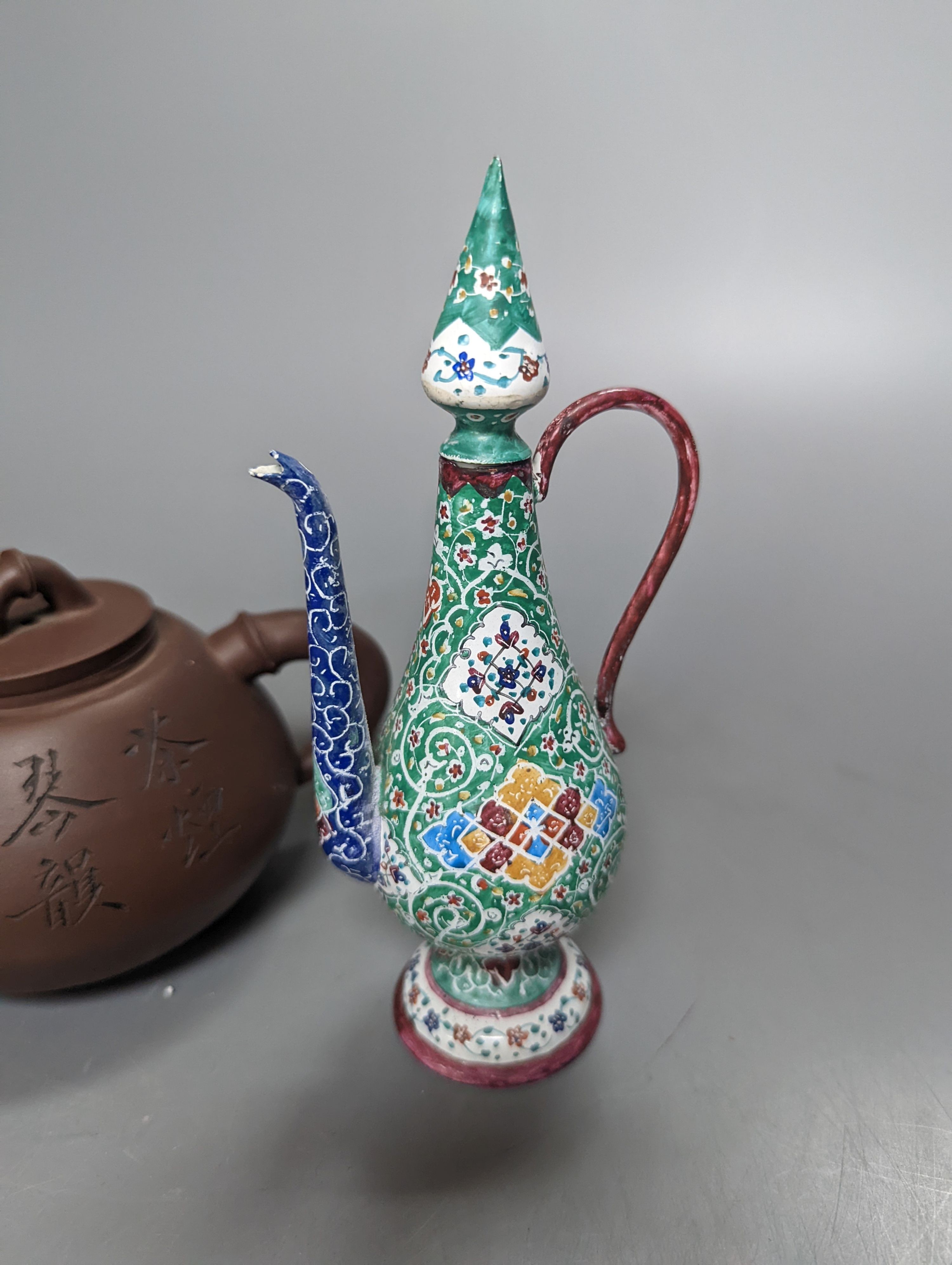 A Chinese Yixing teapot and a Isfahan enamel on copper ewer, 16.5cm high